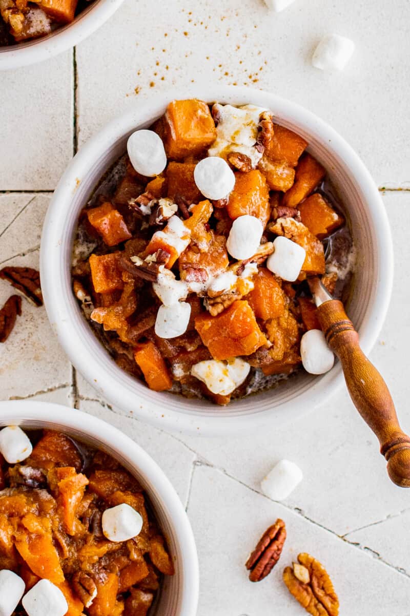 up close white bowl of crockpot sweet potato casserole