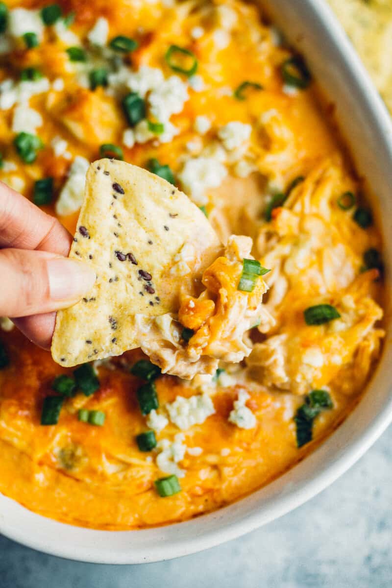 dipping chip into instant pot buffalo chicken dip