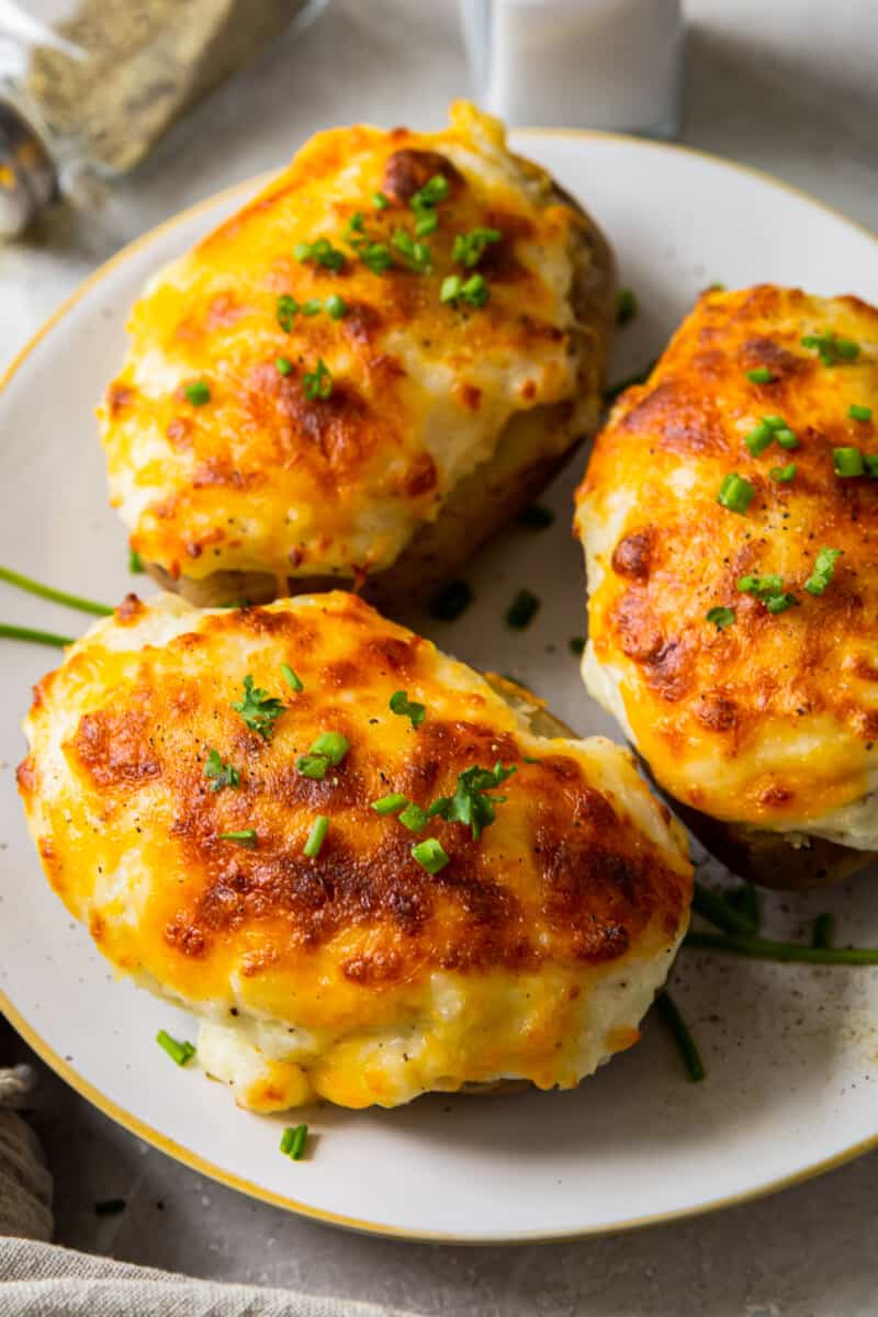 three instant pot twice baked potatoes on plate
