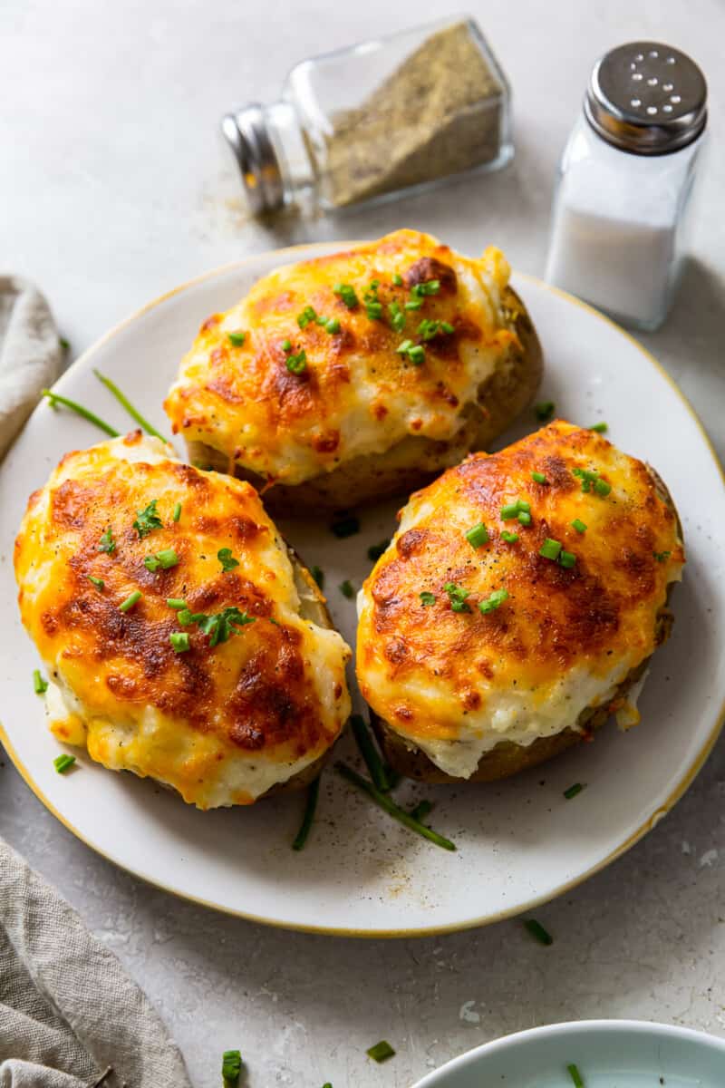 three instant pot twice baked potatoes on plate