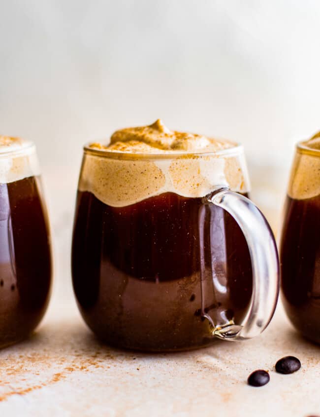 3 clear mugs with pumpkin cold foam coffee