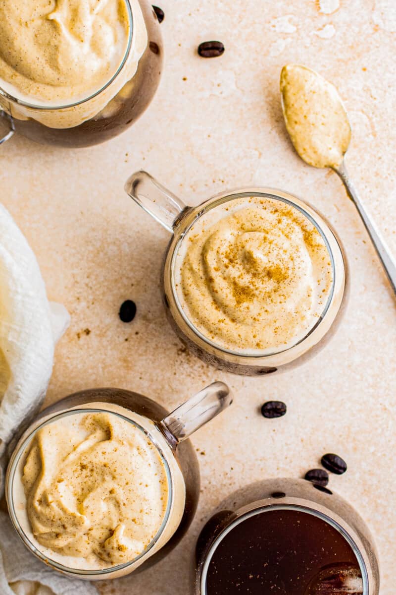 overhead pumpkin cold foam over coffee in clear mugs