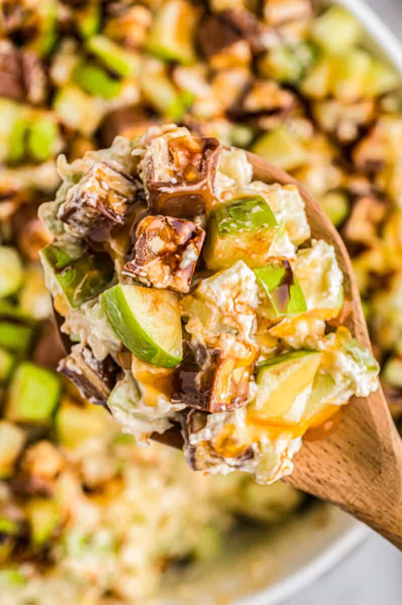 wooden spoon with snickers apple salad
