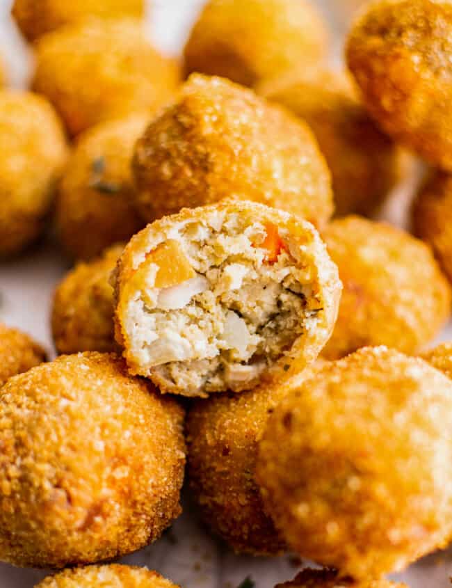 up close inside of turkey croquette cut in half on top of full croquettes