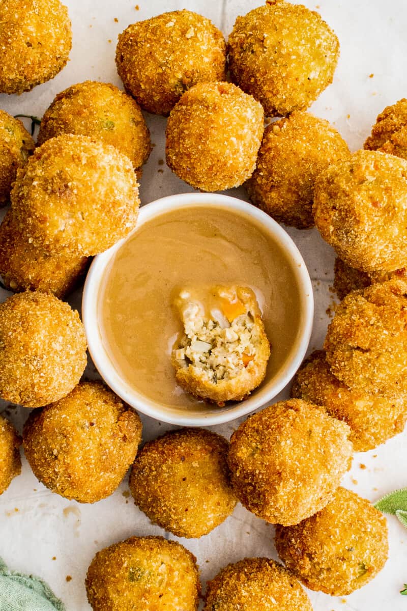 dipping turkey croquette in gravy