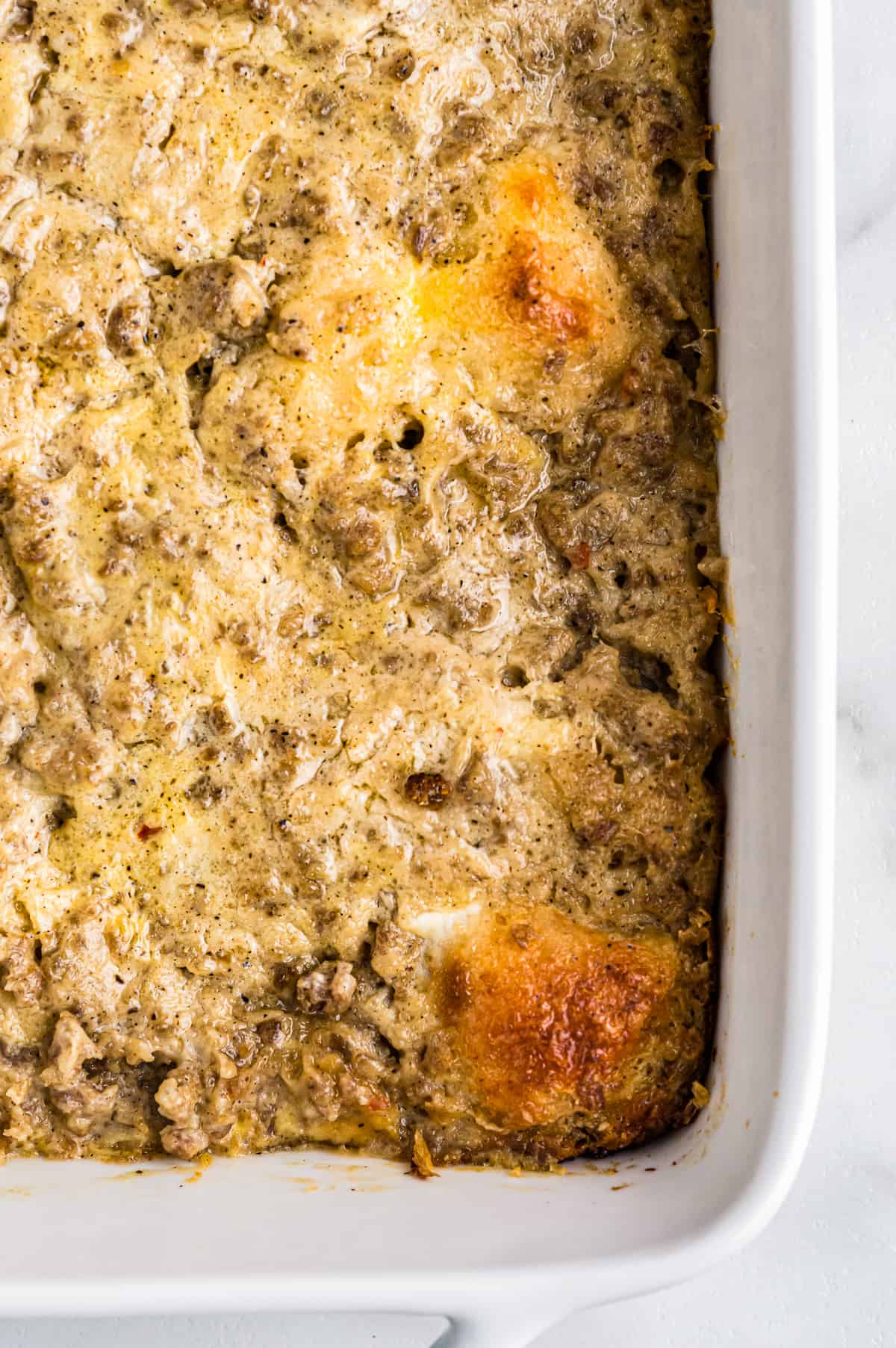 biscuits and gravy casserole in a white baking pan