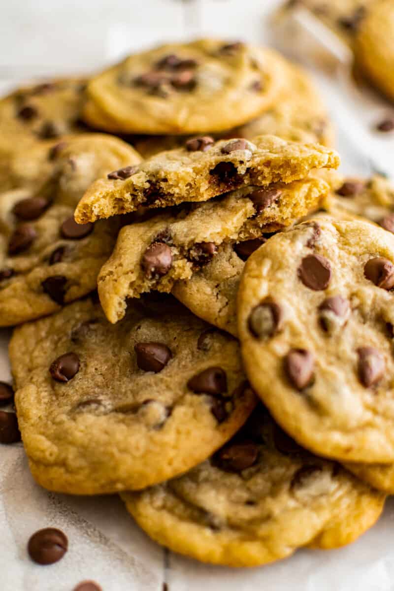 brown butter chocolate chip cookies with one cookie broken in half showing the texture