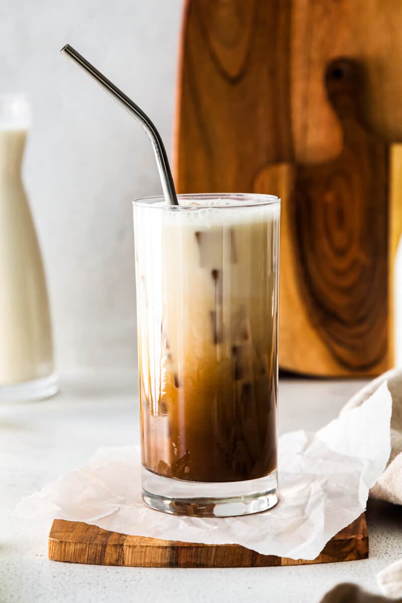 iced brown sugar shaken espresso in a clear glass with a straw