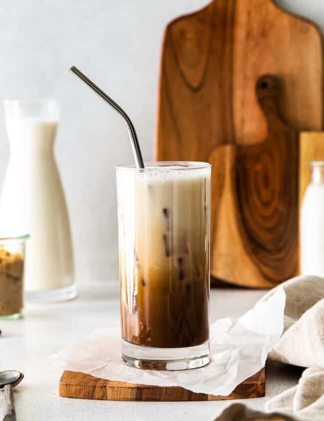 iced brown sugar shaken espresso in a clear glass with a straw