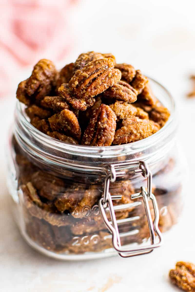 candied pecans in a glass container