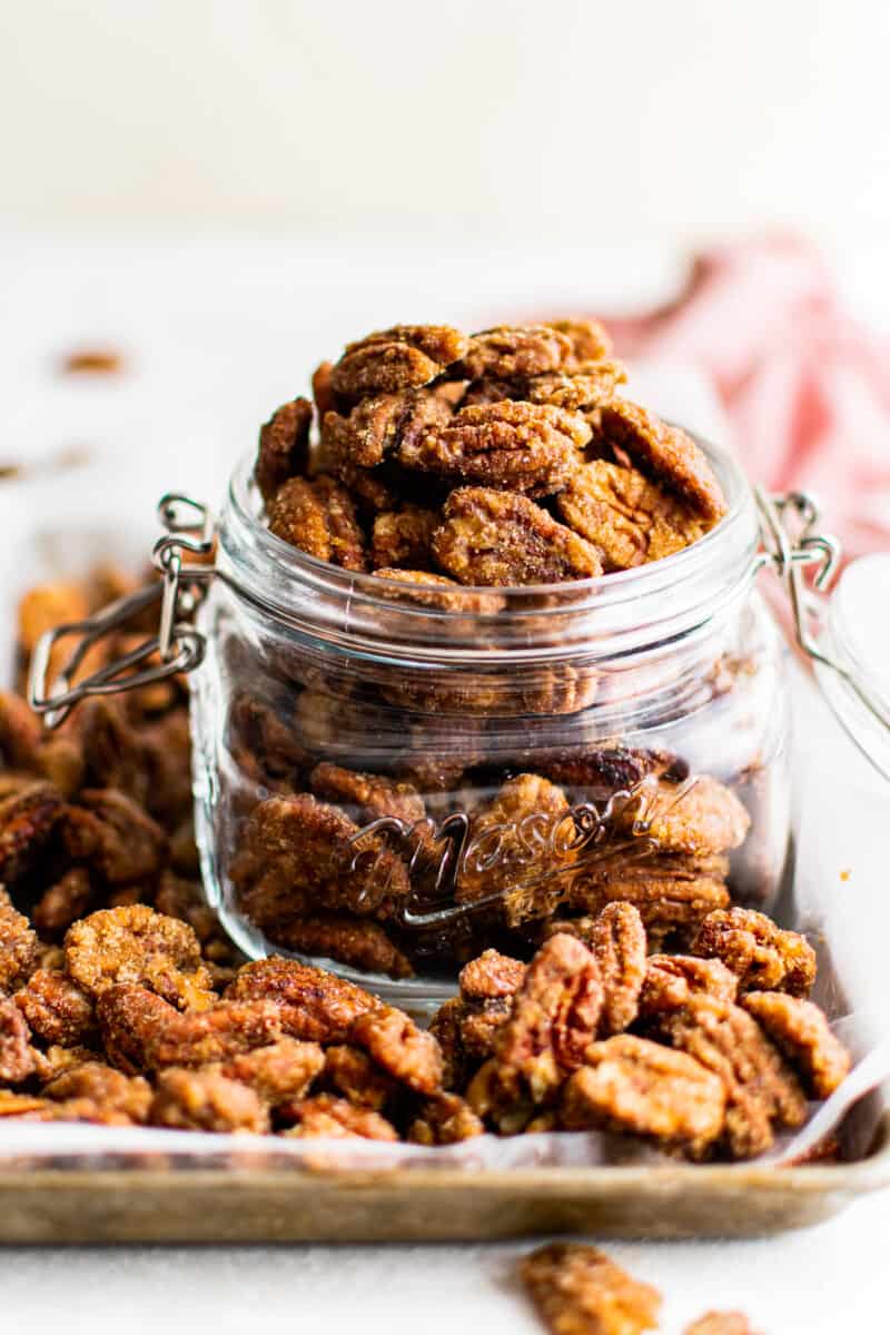 candied pecans in a glass container