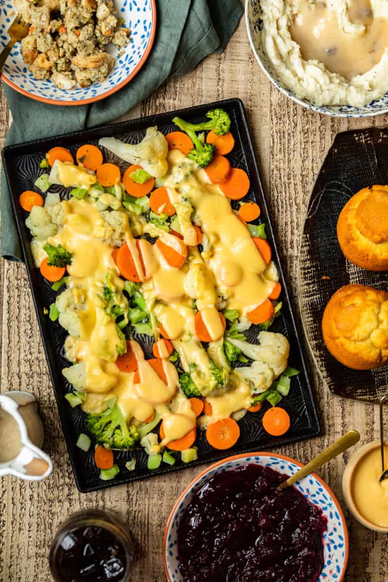 cheesy roasted vegetables on sheet pan