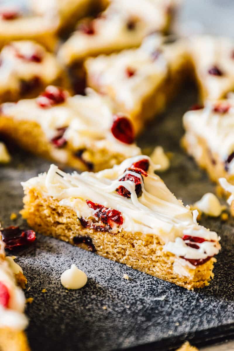 side image of cranberry bliss bars with frosting