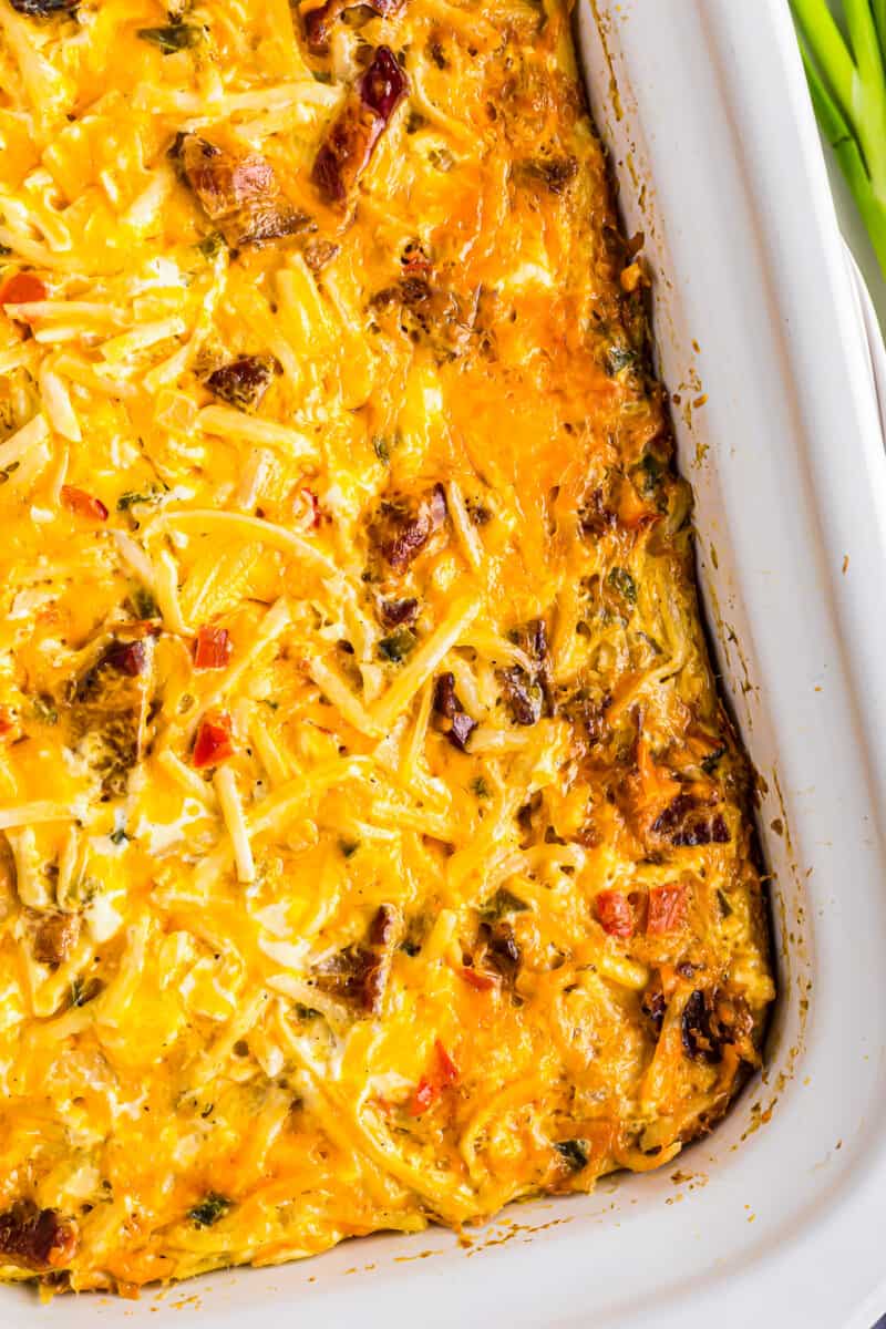 close up overhead image of breakfast casserole in white shallow casserole dish