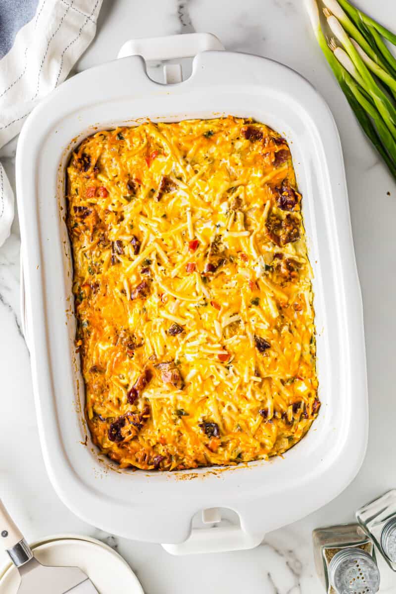 overhead image of breakfast casserole in white shallow casserole dish