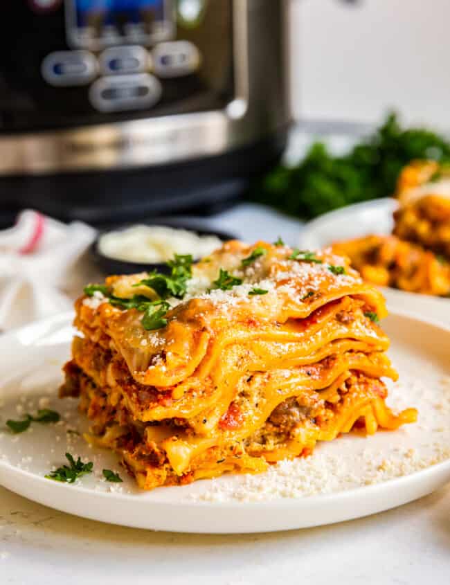 crockpot lasagna next to slow cooker