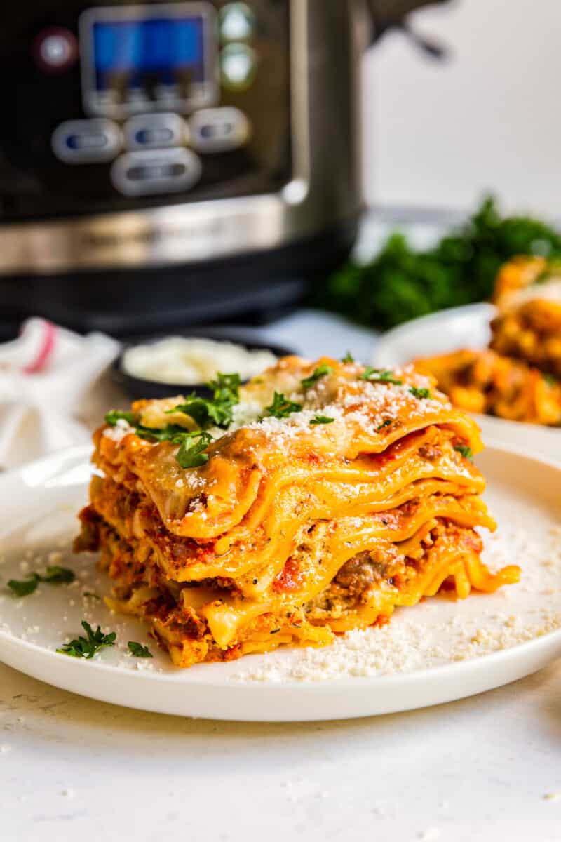 crockpot lasagna next to slow cooker