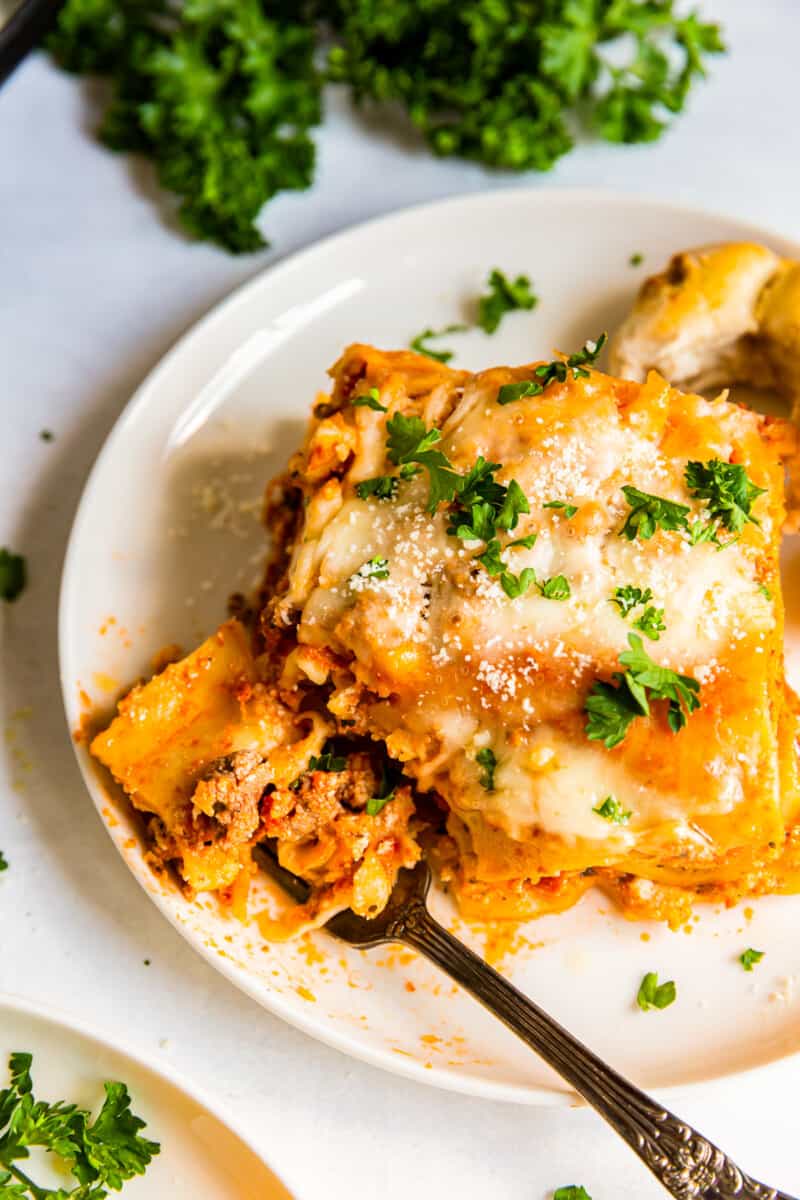 overhead slice of crockpot lasagna with bite