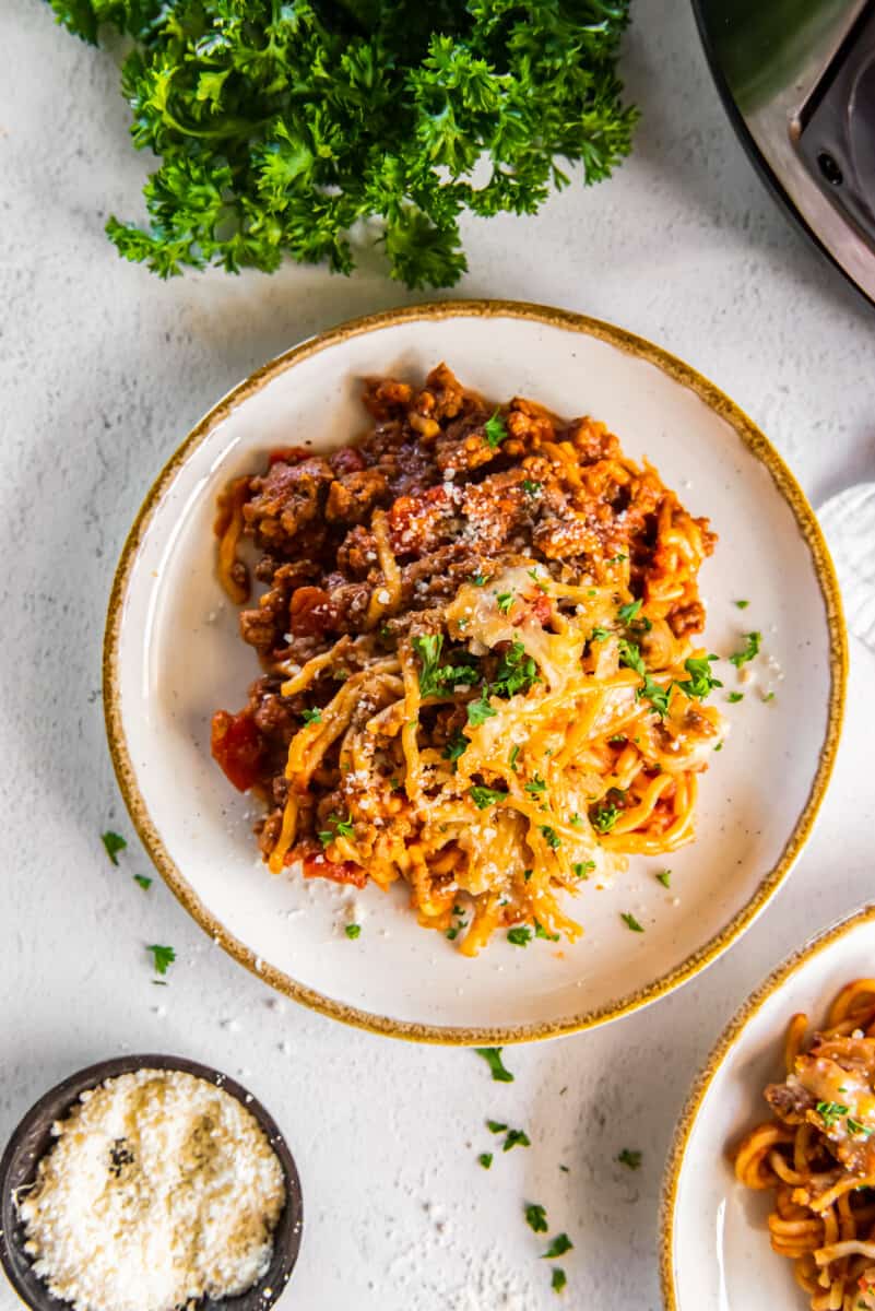 overhead image of a serving of spaghetti casserole on a white plate