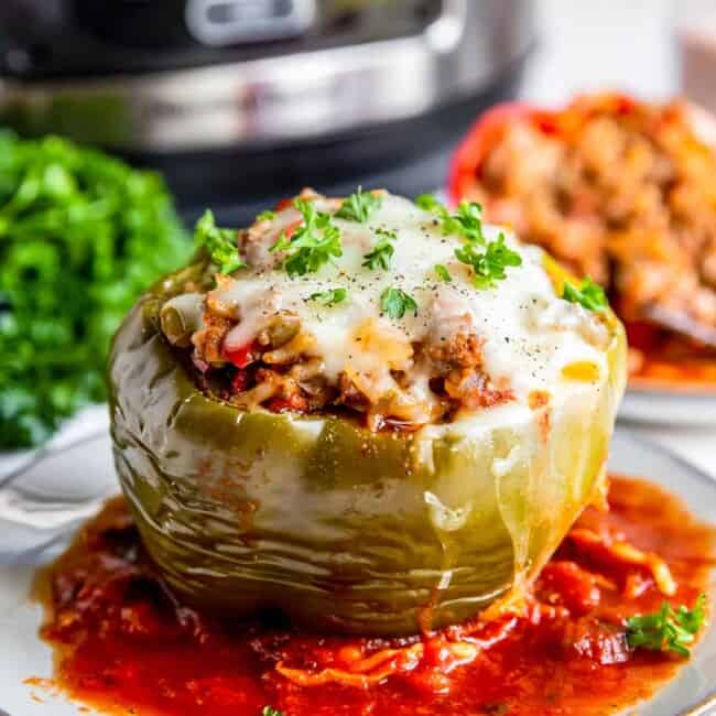 crockpot stuffed pepper with sauce on a plate