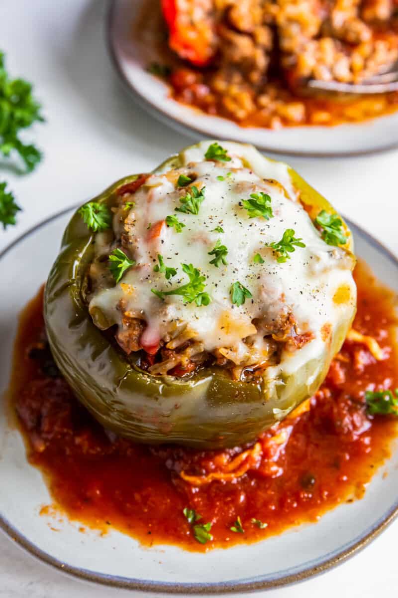 crockpot stuffed pepper with sauce on a plate