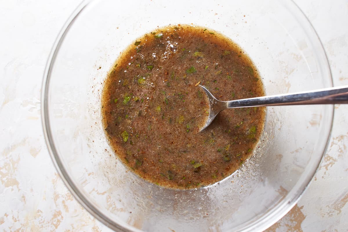 Wet ingredients for butternut squash stuffing in a glass bowl.