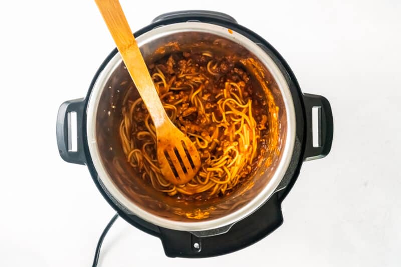 spaghetti in instant pot with wood spoon