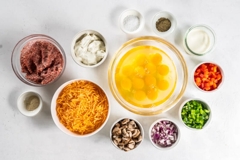 ingredients for sausage cheese breakfast casserole in bowls