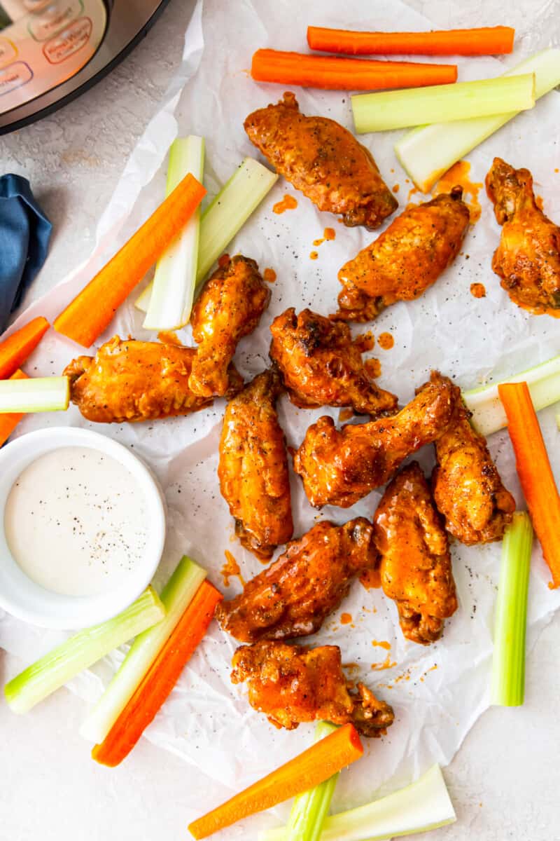 overhead image of buffalo chicken wings with carrots, celery, and ranch dressing
