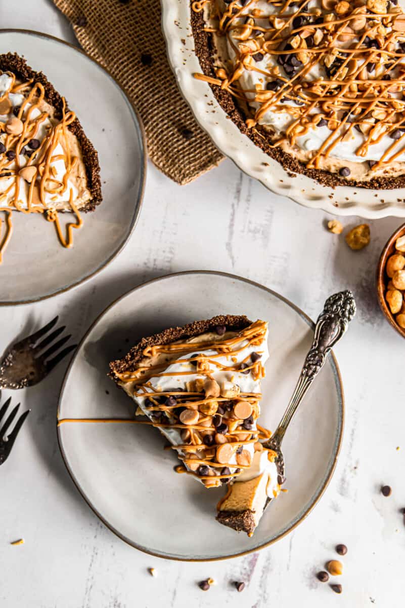 slices of peanut butter pie on plates with forks