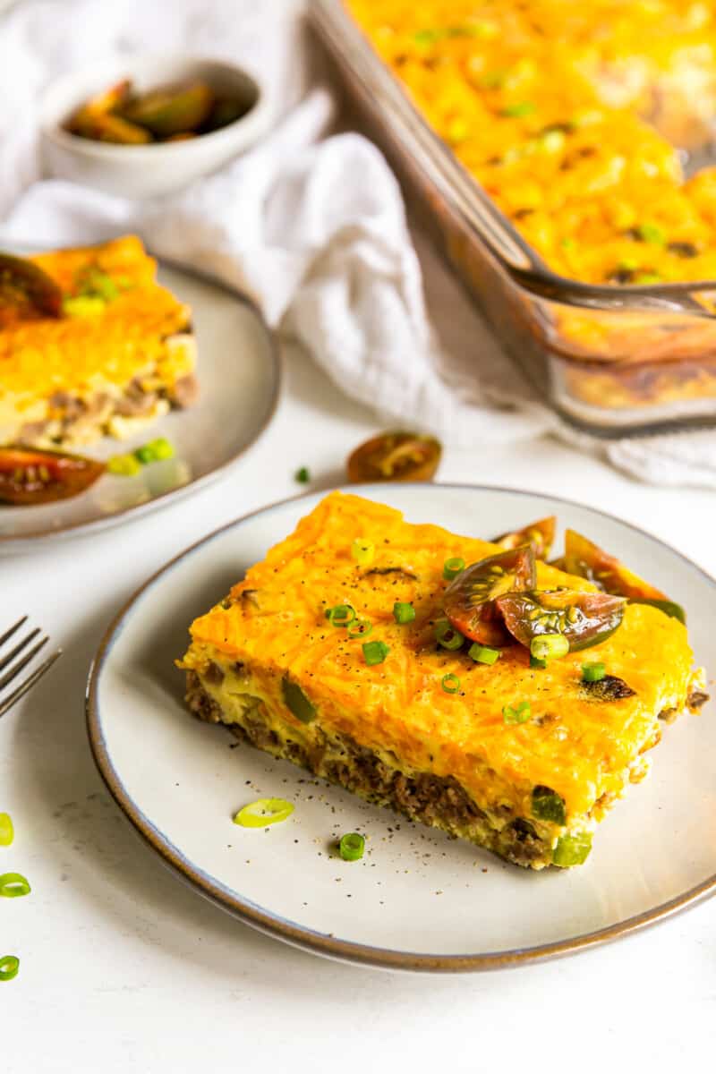 pieces of sausage breakfast casserole on white plates