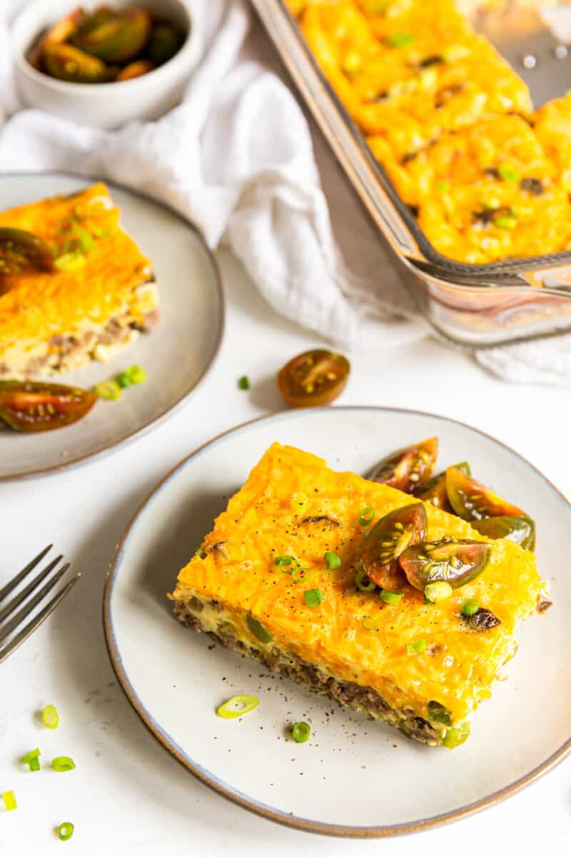 pieces of sausage breakfast casserole on white plates