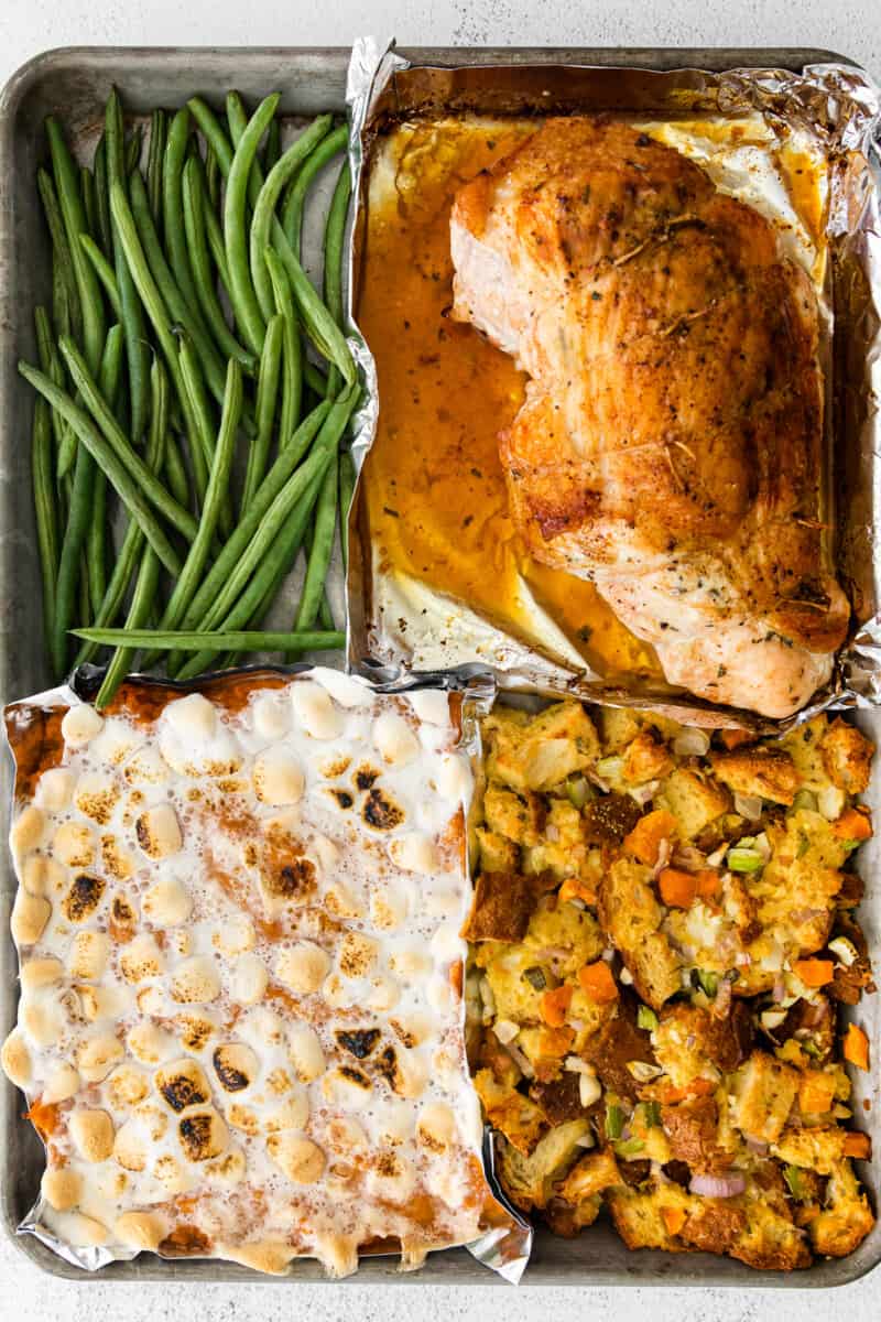 4 parts of sheet pan thanksgiving including sweet potato casserole, dressing, green beans, and turkey breast