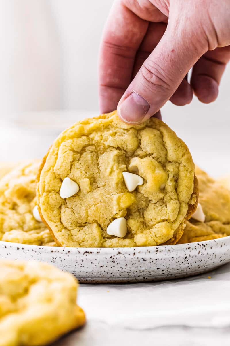 up close white chocolate macadamia nut cookies on white plate