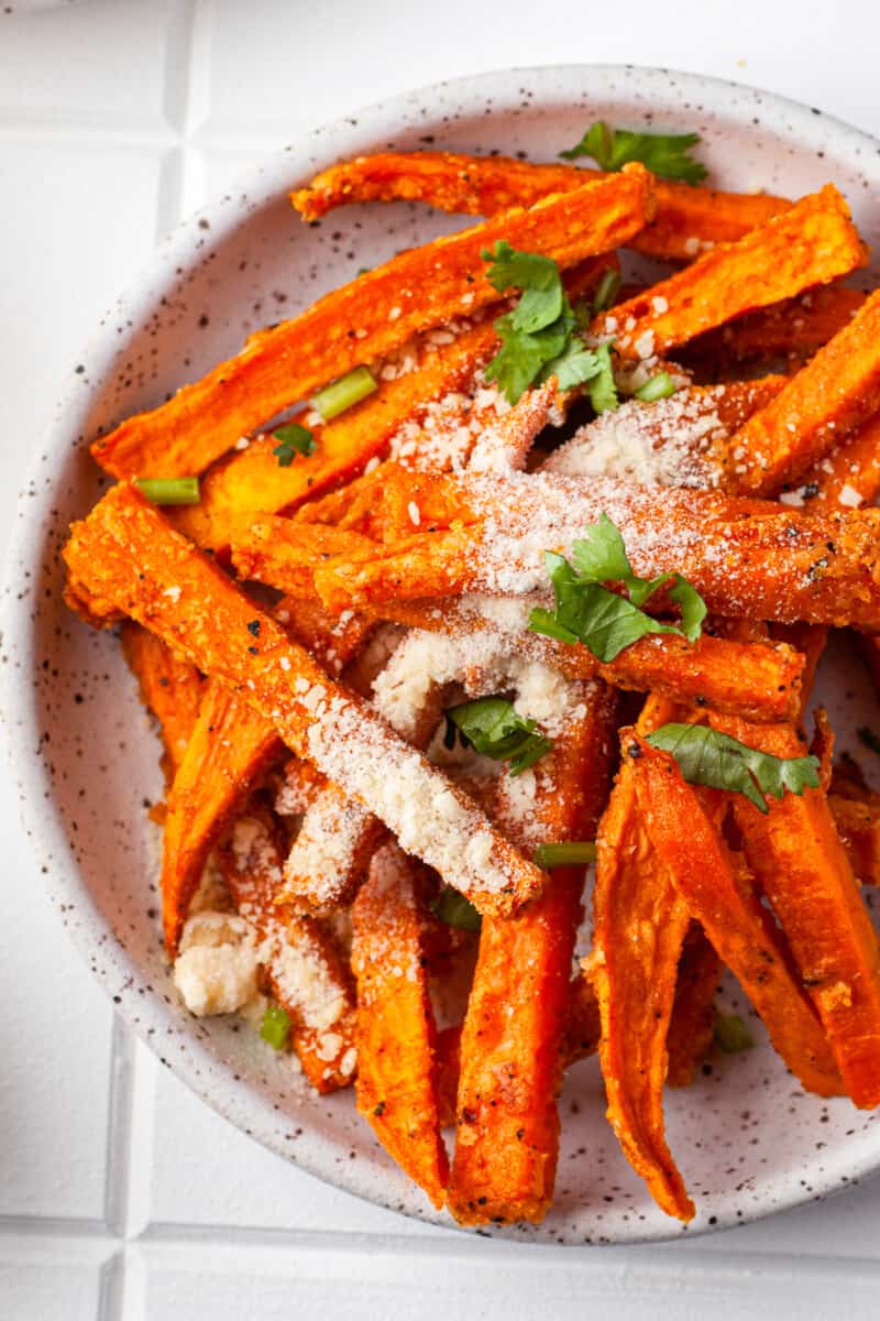 overhead plate with garlic parmesan sweet potato fries