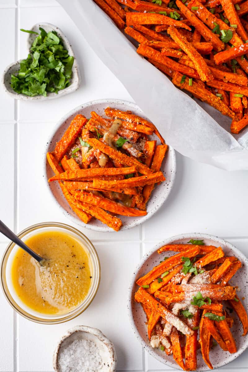 plates of garlic parmesan sweet potato fries