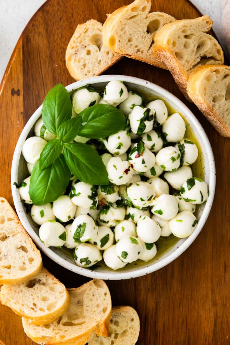 herb marinated mozzarella in white bowl