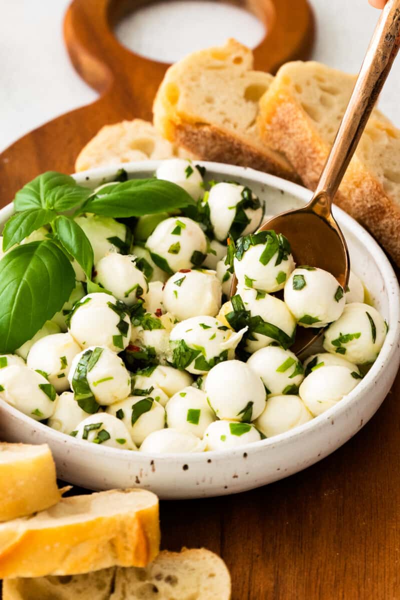 spoon dipping into mozzarella