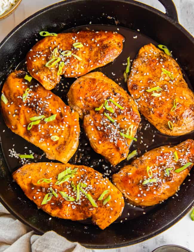 honey garlic chicken breasts in a skillet