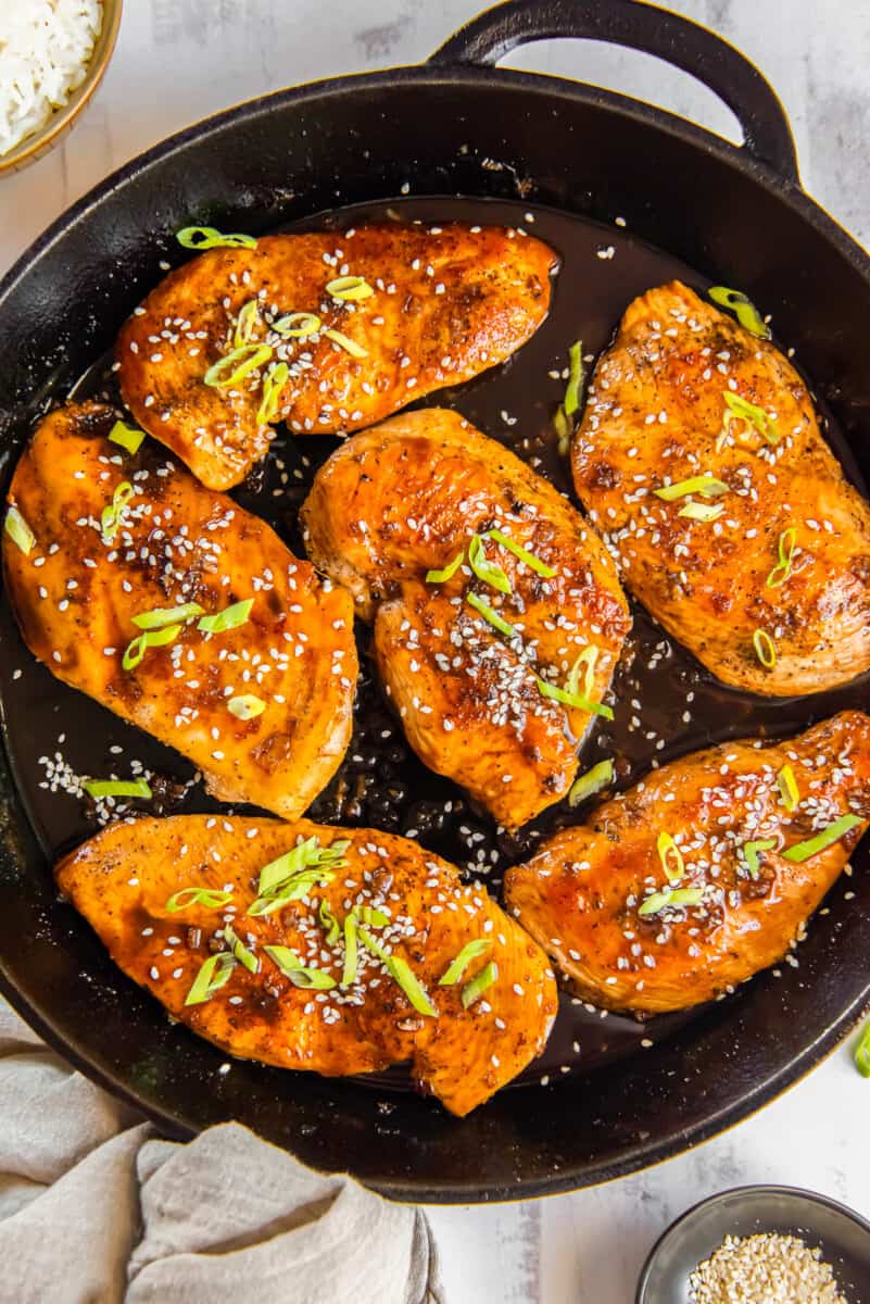 honey garlic chicken breasts in a skillet