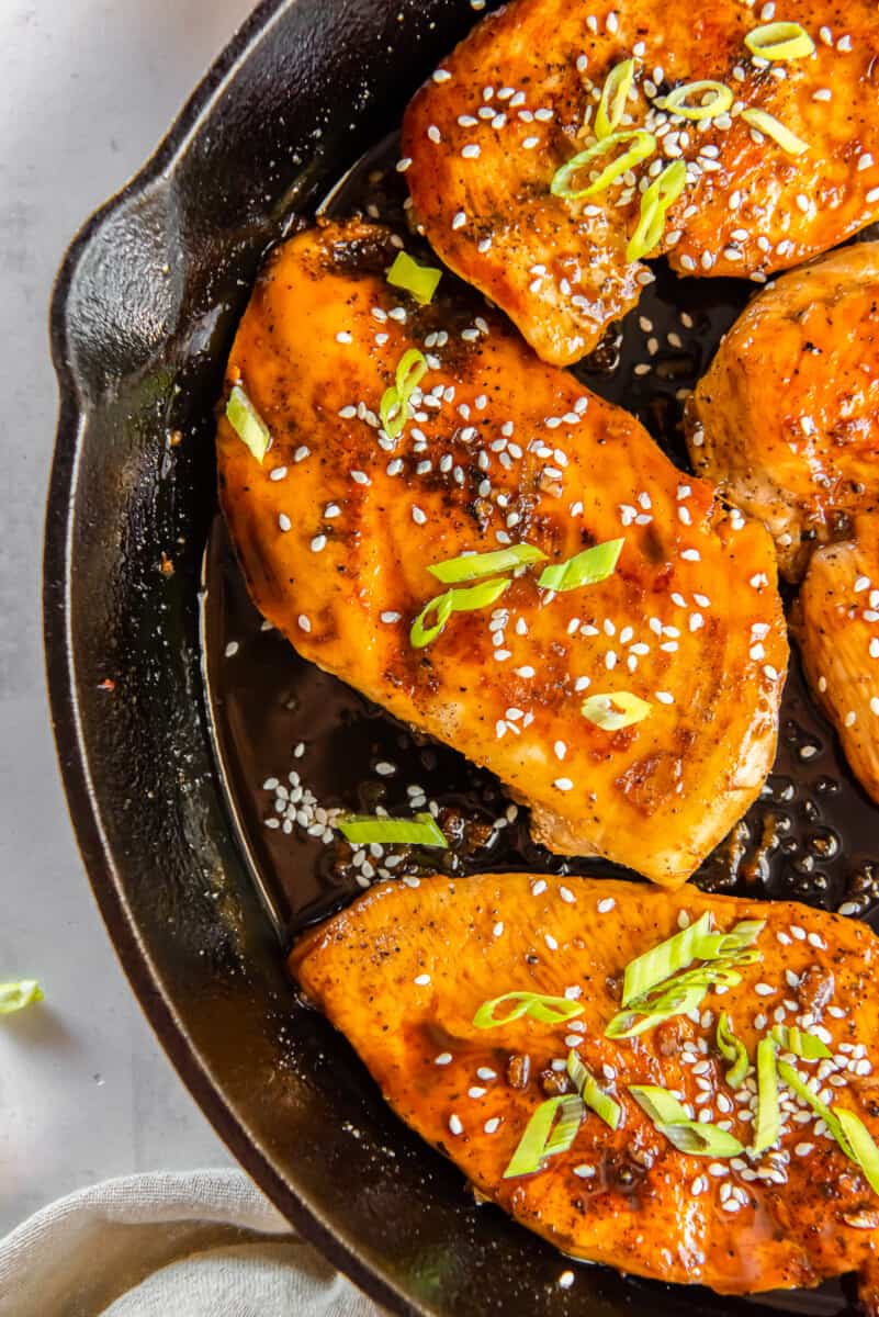 honey garlic chicken breasts in a skillet