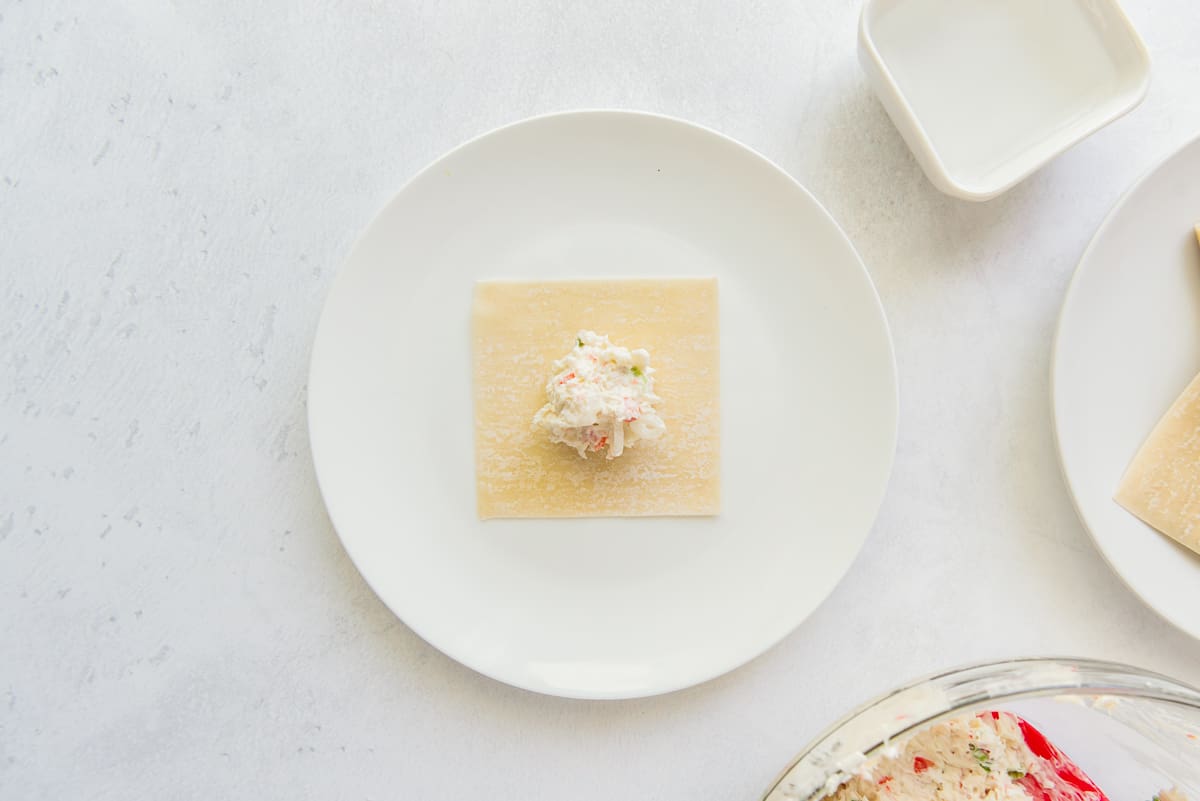 Crab and cream cheese mixture on a wonton. - 8