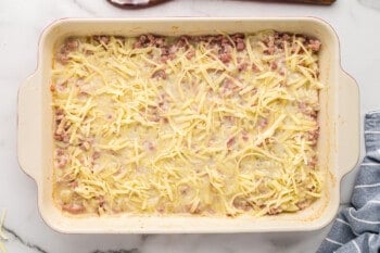 ham and potato casserole topped with cheese before finished baking