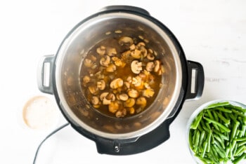 mushrooms, onion, garlic, and broth in instant pot