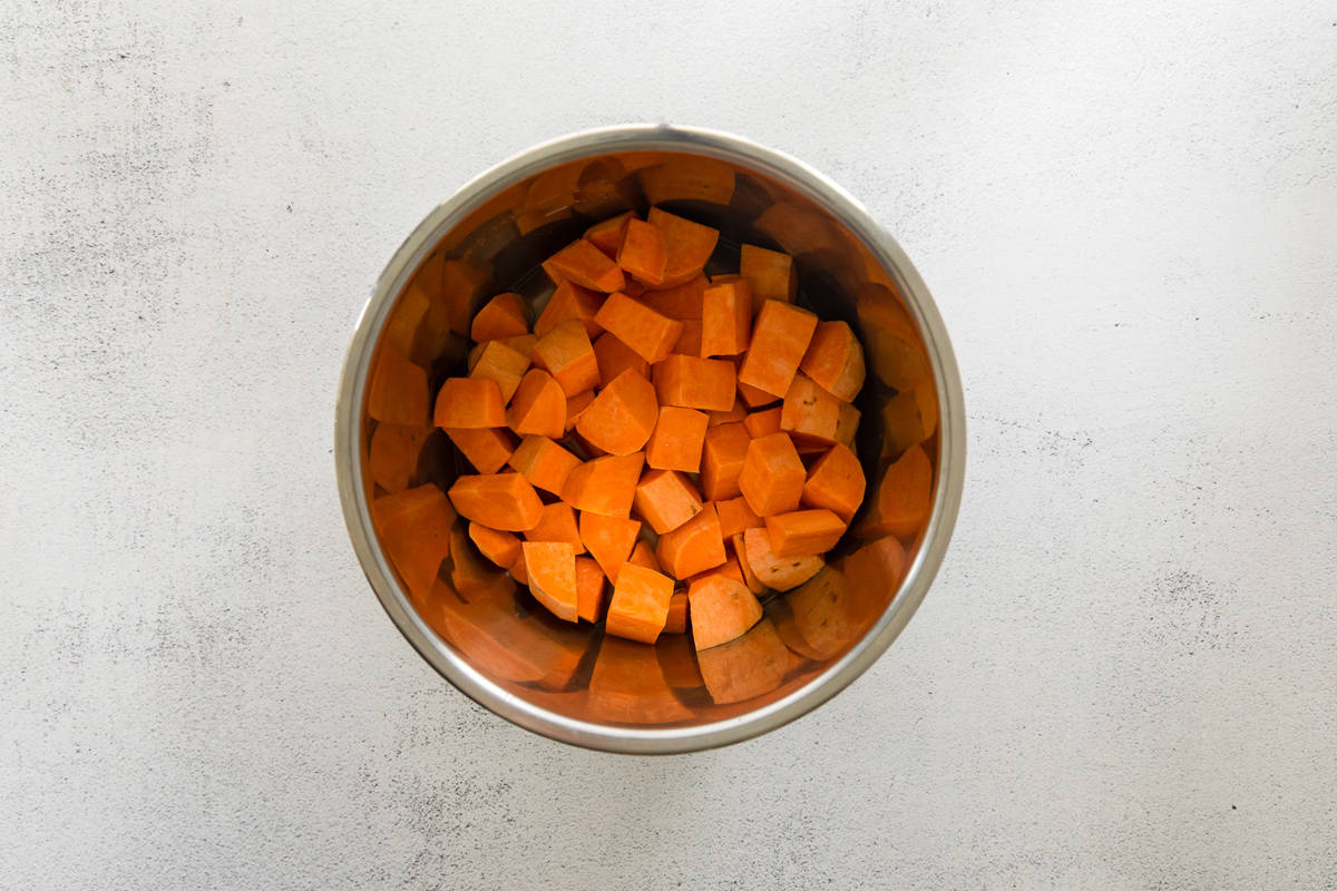 Cubed sweet potatoes in an Instant Pot bowl.