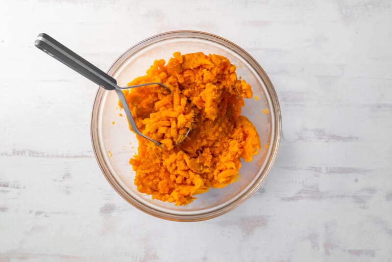 mashed sweet potatoes in glass bowl