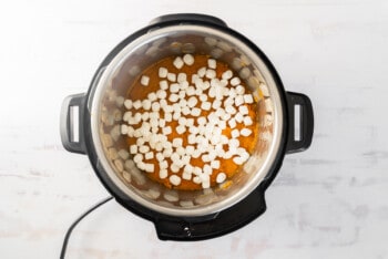 mini marshmallows on top of sweet potato casserole filling in instant pot