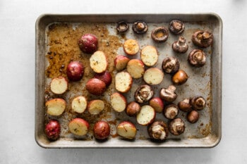 red potatoes and mushrooms on a sheet pan