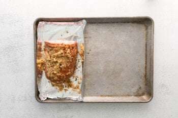 brown sugar ham on a sheet pan before baking