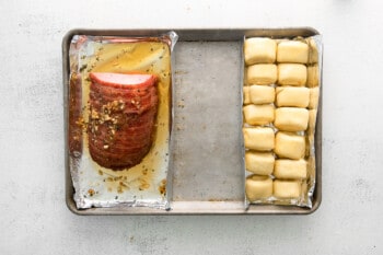 ham and rolls on a sheet pan before baking